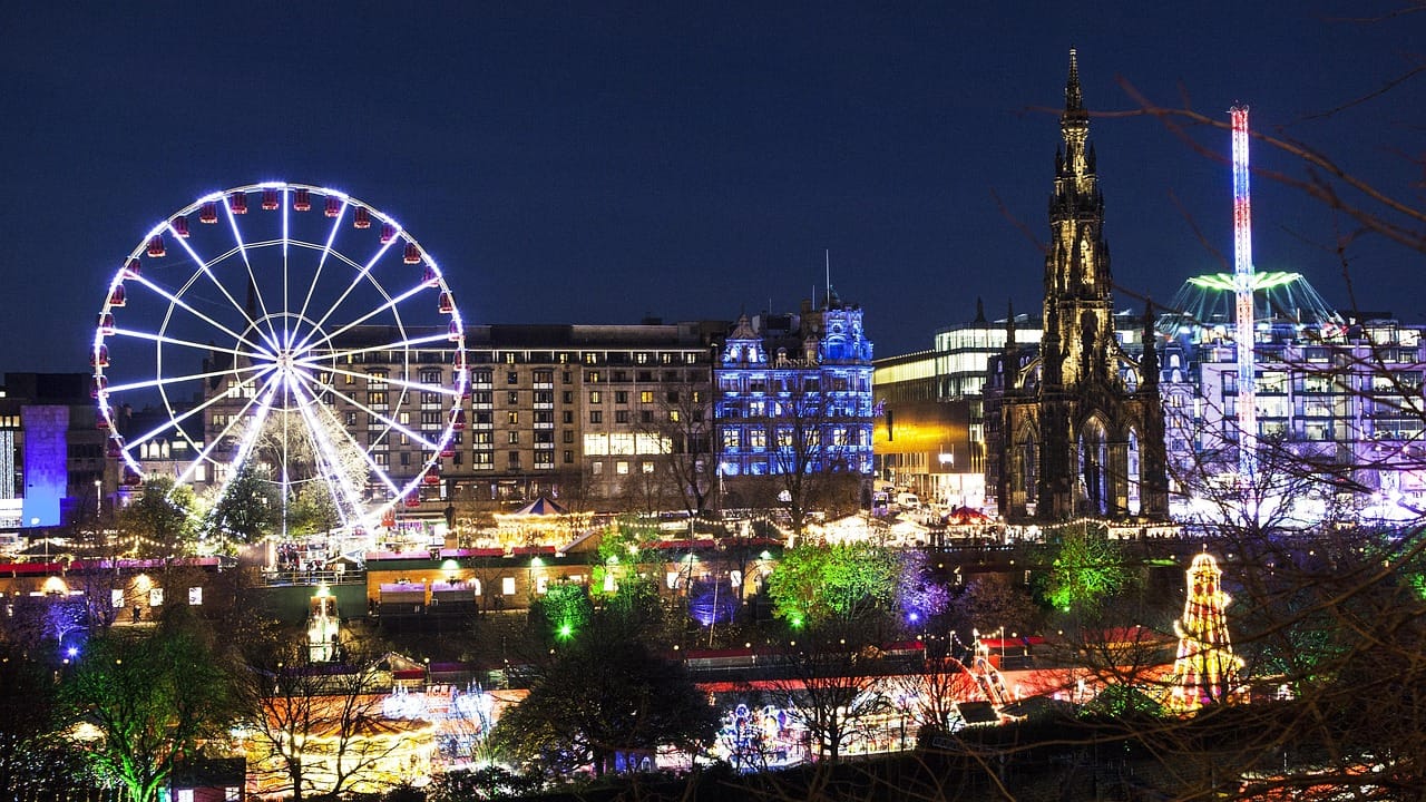 Edinburgh Old Town street in winter with stone buildings and lights