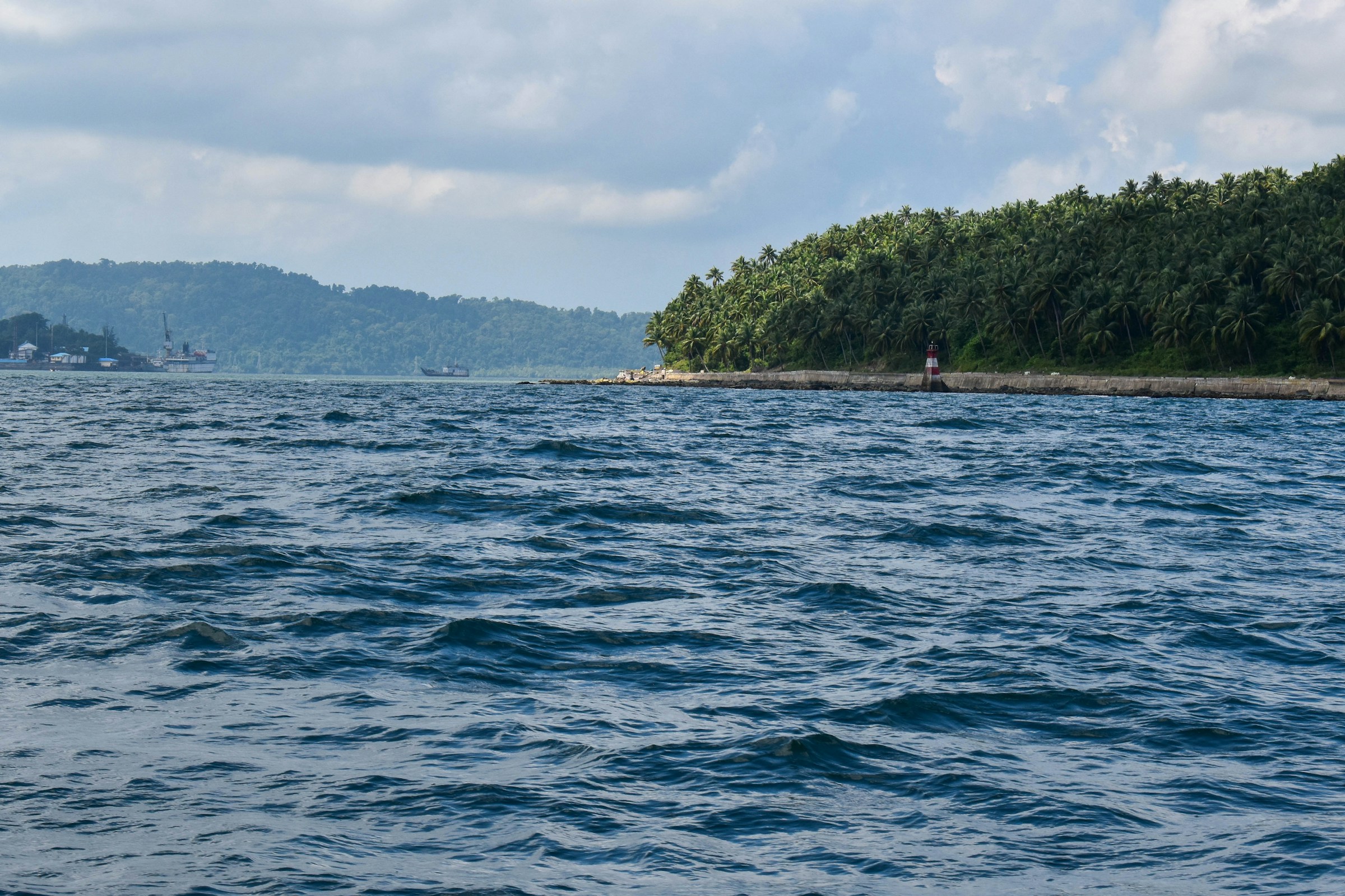 A body of water with a small island in the distance