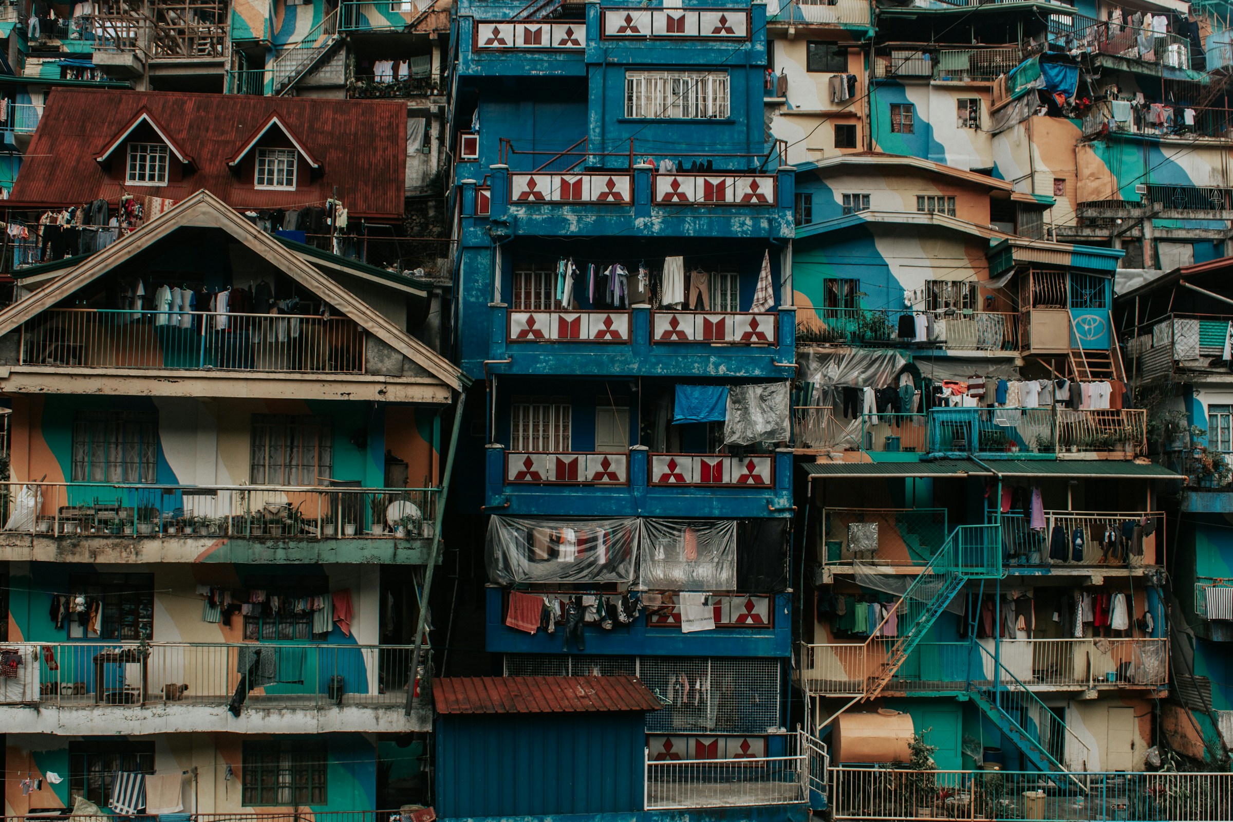 Colorful buildings stacked closely together on a hillside.