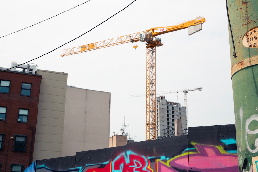 Construction crane against a cloudy sky.