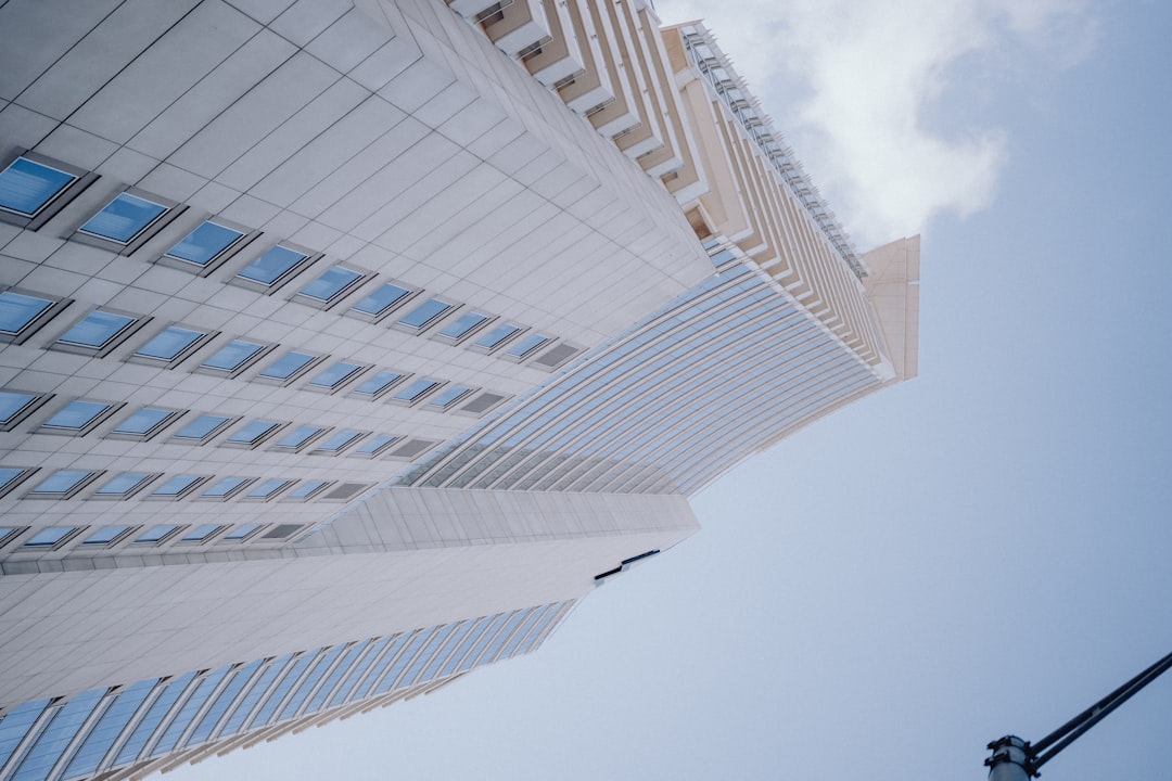 a tall building with a street light in front of it