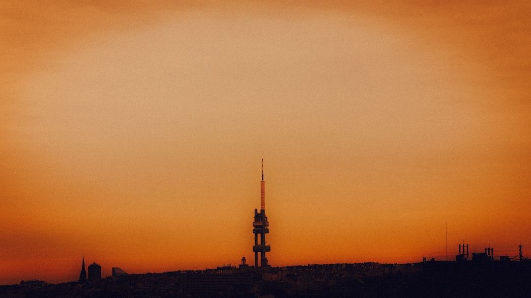 The sun is setting over a city skyline
