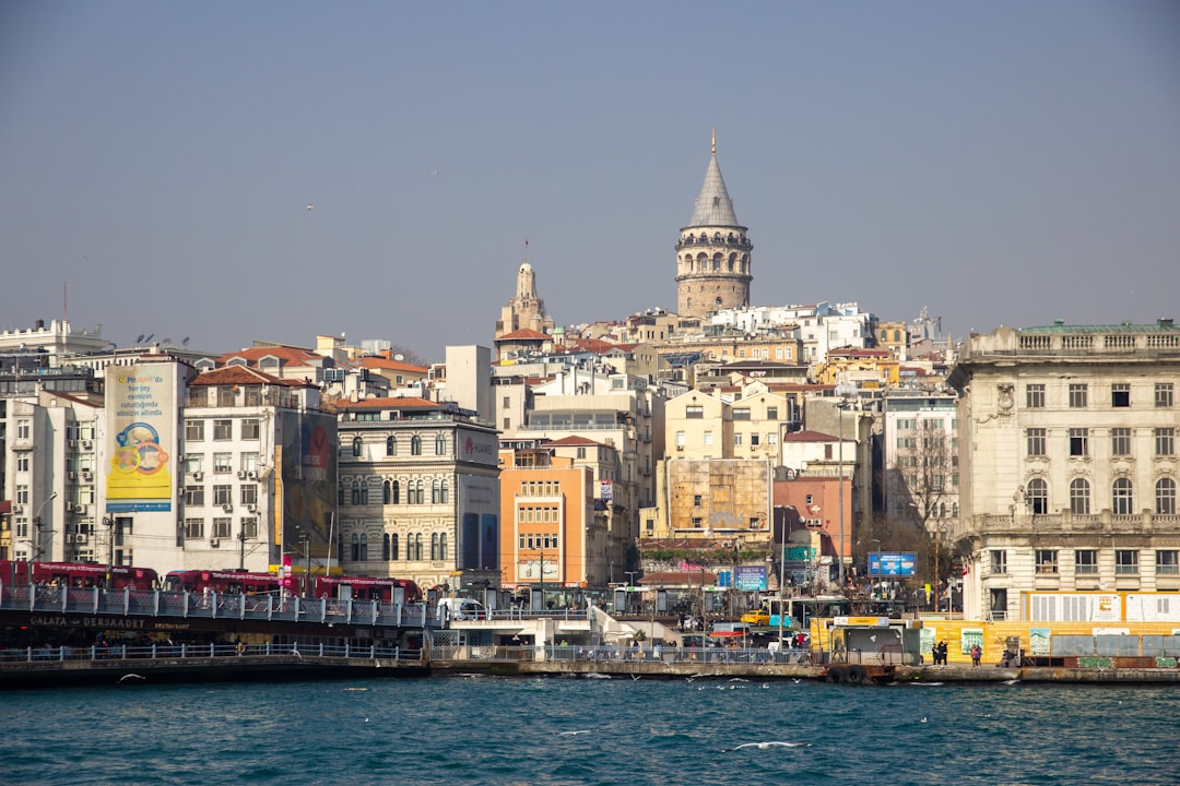 a large body of water with a city in the background