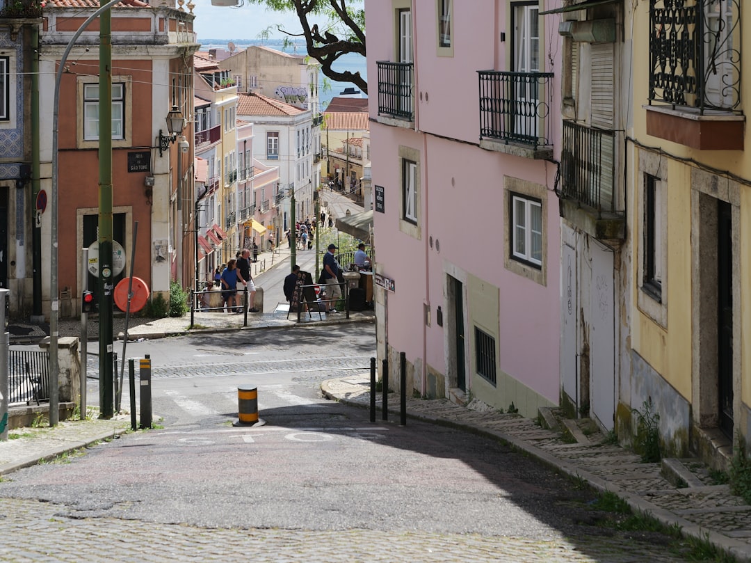 Cobblestone street in a european city with buildings.