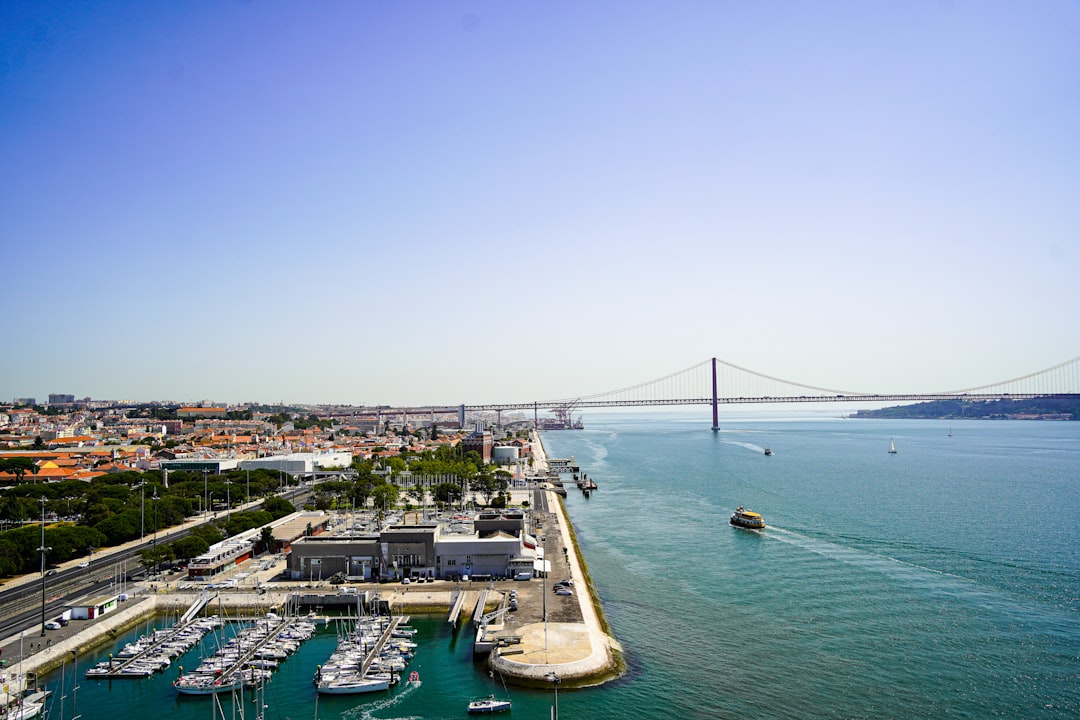 a large body of water with a bridge in the background